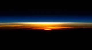A new day begins on the International Space Station in this spectacular sunrise snapshot from NASA astronaut Tim Kopra.