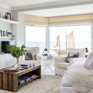 white themed living room with windows