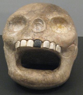 photo of a monkey-shaped mayan skull at the royal ontario museum