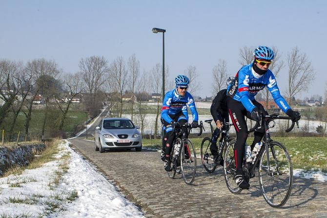 Garmin-Sharp's Martijn Maaskant and Tyler Farrar are joined by former teammate Heinrich Haussler (IAM Cycling) to recon the Haaghoek pave sector.