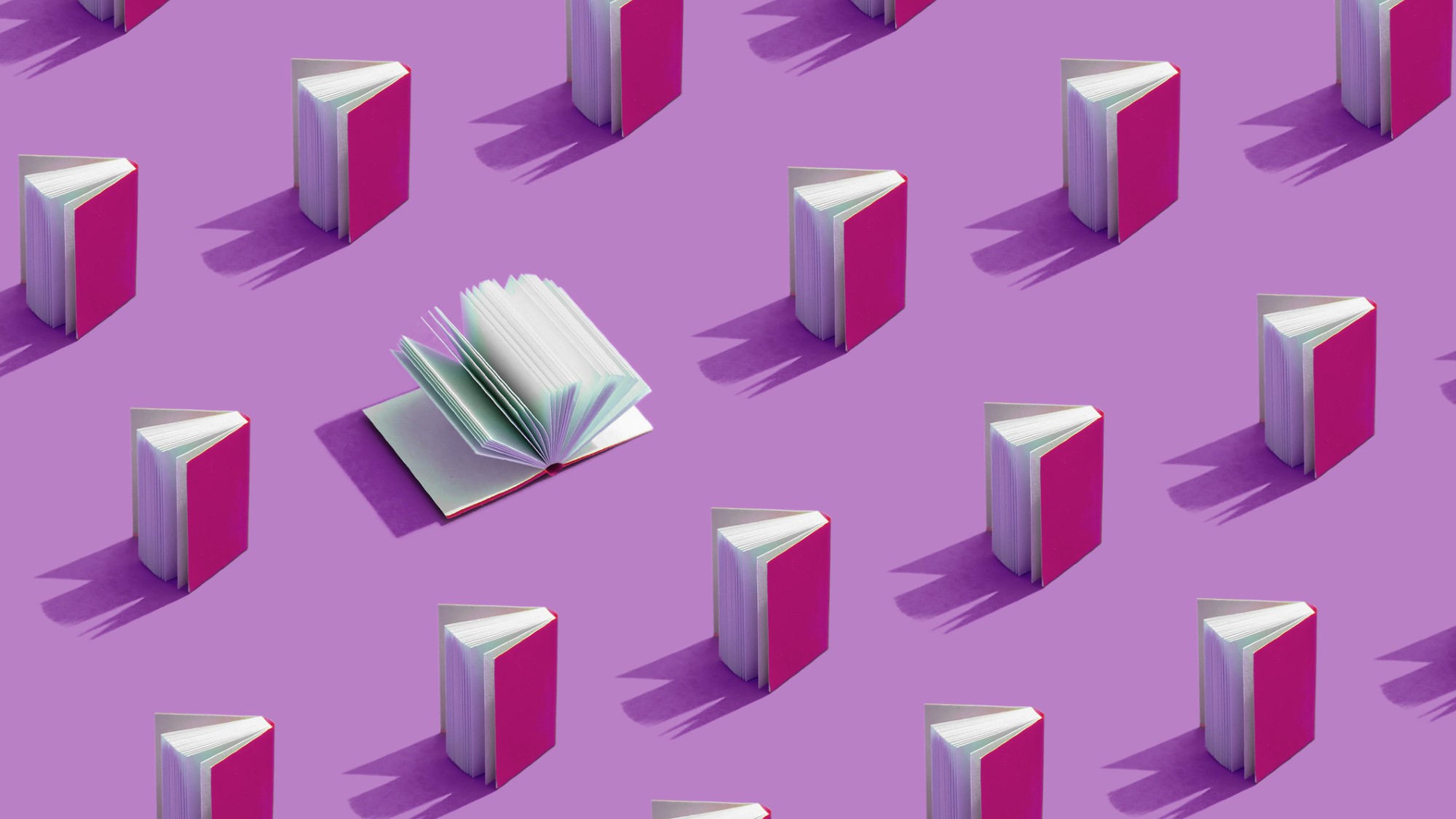 An illustration of many hardcover books standing. One is open and the pages flip.