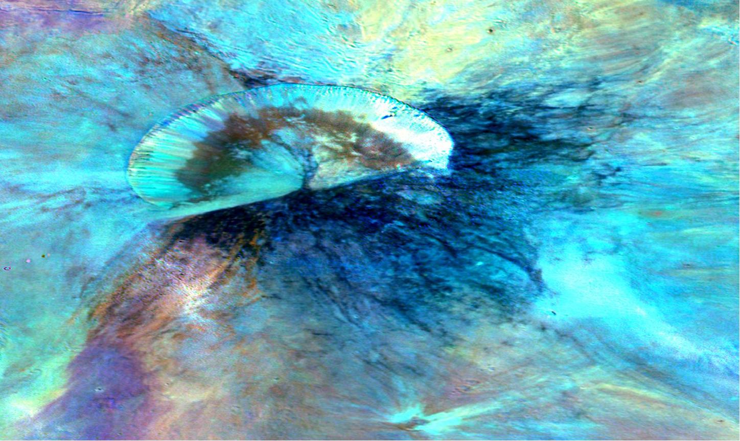 This colorized composite image from NASA's Dawn mission shows the crater Antonia, which lies in the enormous Rheasilvia basin in the southern hemisphere of the giant asteroid Vesta. The area lies around 58 degrees south latitude. Antonia has a diameter of 11 miles (17 kilometers). The image was taken by Dawn's framing camera from September to October 2011.