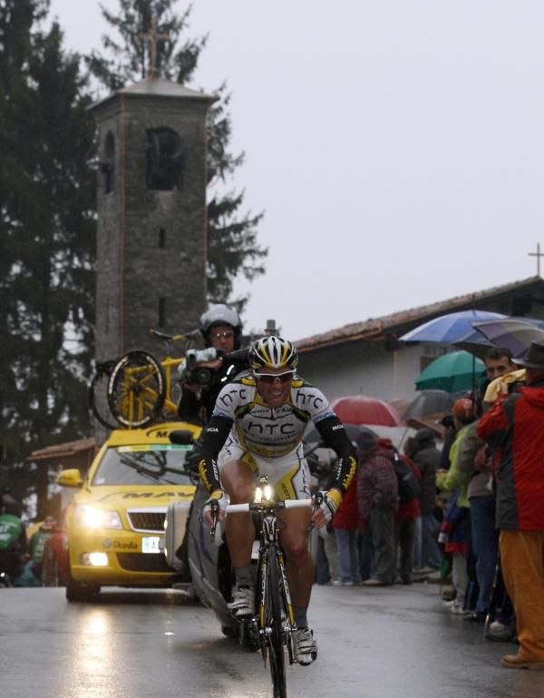 Michael Albasini (HTC-Columbia) crests the summit of the Madonna del Ghisallo, passing the church dedicated to the patron of cyclists.