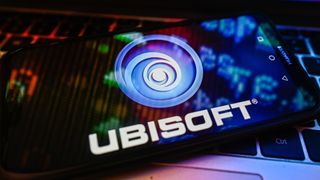 POLAND - 2023/11/09: In this photo illustration a UbiSoft logo is displayed on a smartphone with stock market percentages on a laptop. (Photo Illustration by Omar Marques/SOPA Images/LightRocket via Getty Images)