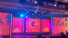 Pure Accelerate logo and branding pictured on the keynote stage at the Resorts World Las Vegas conference center.