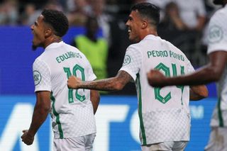 Sporting's Lisbon's English forward Marcus Edwards (L) celebrates scoring the opening goal with his teammate Sporting Lisbon's Spanish defender Pedro Porro during the UEFA Champions League Group D football match Eintracht Frankfurt v Sporting CP in Frankfurt, western Germany, on September 7, 2022.