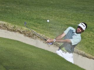 Bubba Watson holed out from a bunker on the 14th