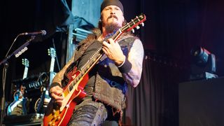 Jon Schaffer of Iced Earth performs on stage at Manchester Academy on October 18, 2013 in Manchester, England.