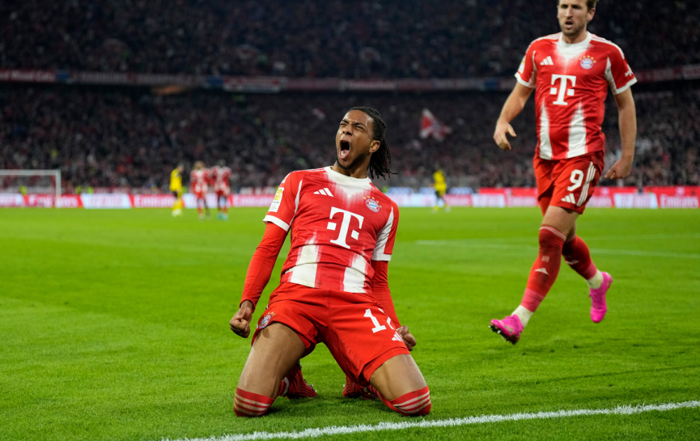 Michael Olise of Bayern Munich celebrates scoring his team's second goal during the Bundesliga match between FC Bayern M&uuml;nchen and Borussia Dortmund at Allianz Arena on October 18, 2025 in Munich, Germany. 