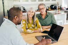 A couple discussing their mortgage options with their broker.