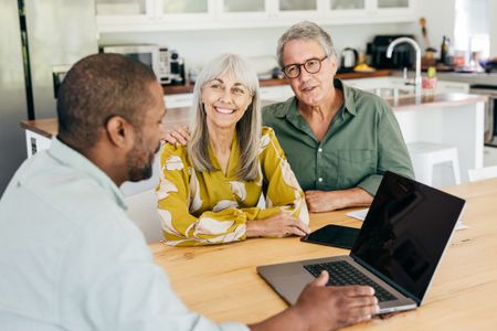 A couple discussing their mortgage options with their broker.