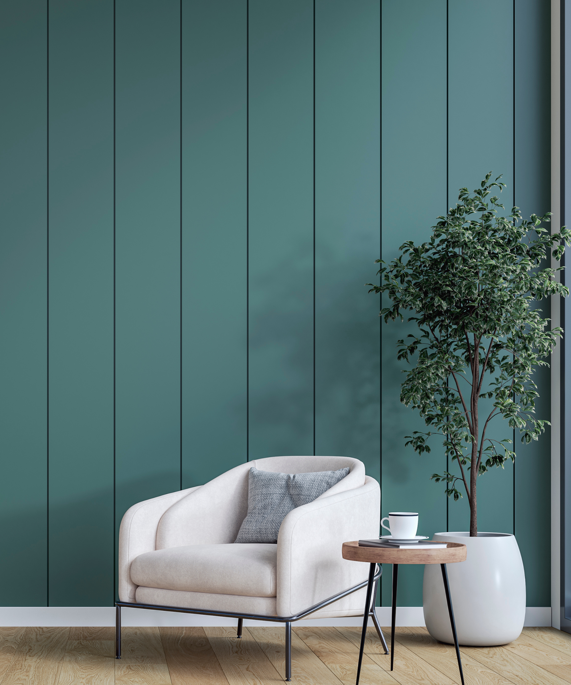 Green shiplap panelled wall with a white chair, wooden and black coffee tablem and potted plant in front of it