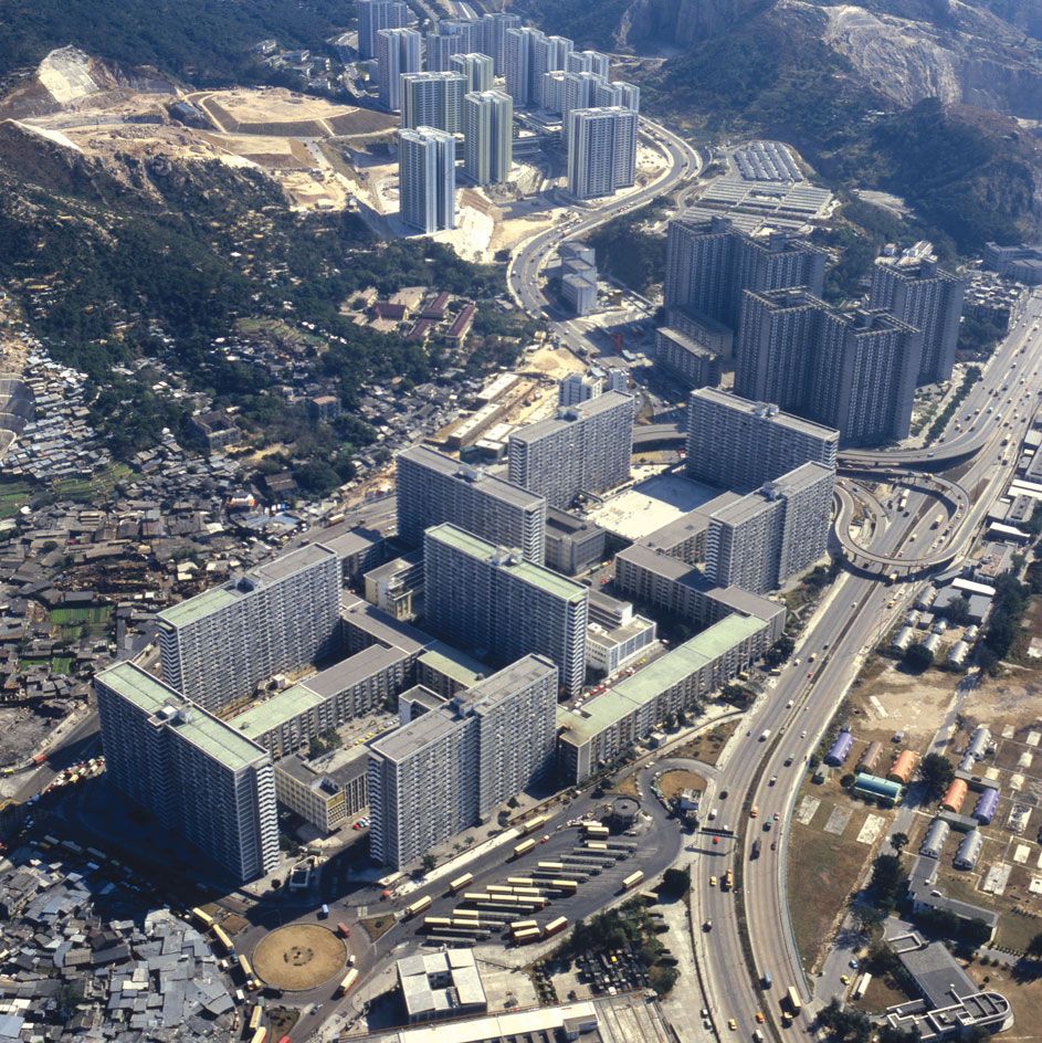 aerial view of city with tall buildings and motorways