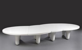 Low curved table made of gel-coated fibreglass-reinforced plastic