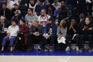 selena gomez and benny blanco sitting courtside at a basketball game