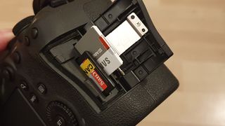 Canon camera details featuring the top and memory card slots