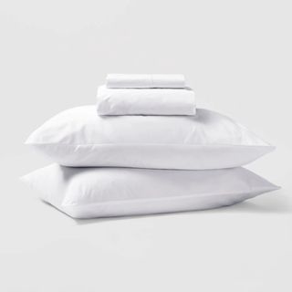 Riley Home Percale Sheet Set against an off-white background. 