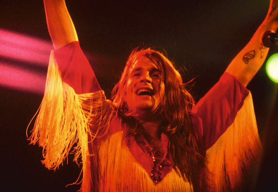 Ozzy Osbourne onstage, arms aloft in triumph