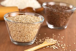 Flax seeds and sesame seeds in a bowl