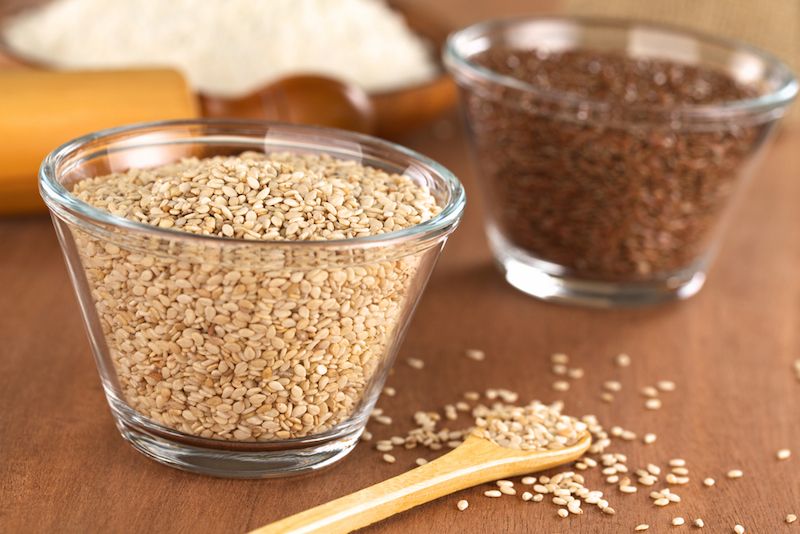 Flax seeds and sesame seeds in a bowl