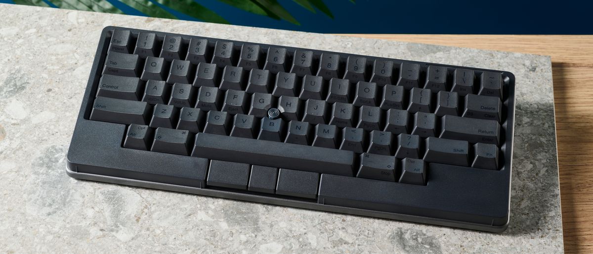 A photo of the HHKB Studio mechanical keyboard on a stone surface