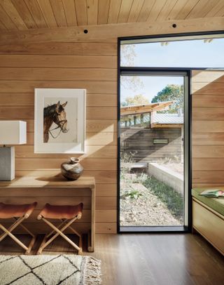 study detail with orthogonal window and horse picture at Verde Creek Residence by Lake Flato