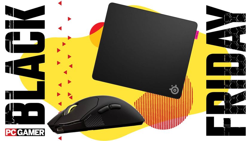 A Corsair Sabre V2 Pro mouse and SteelSeries QcK Performance mouse pad on a custom Black Friday background