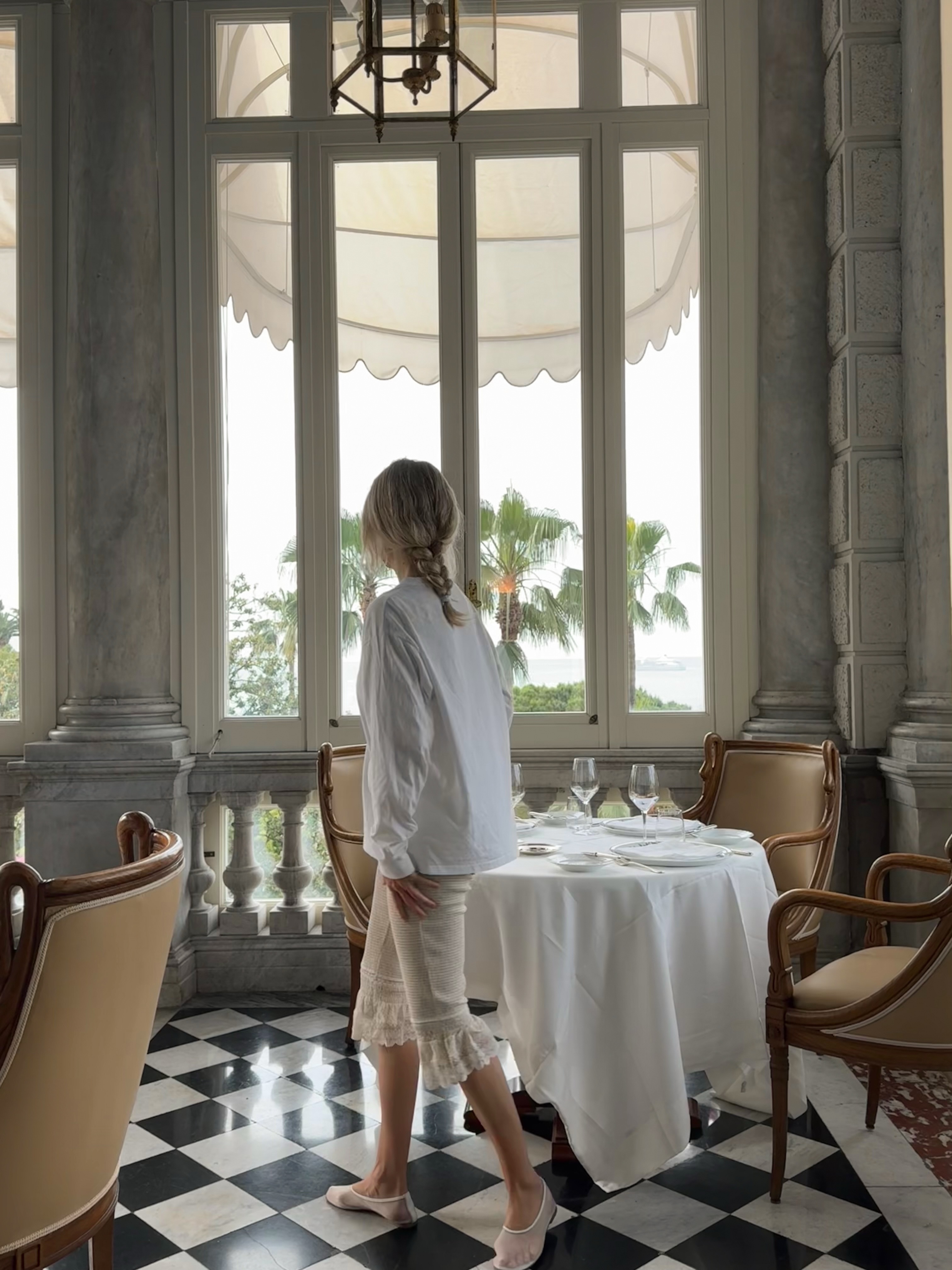 An image of @josefinehj wearing peplum trousers, one of the best anti-jeans summer trouser trends with a white shirt.