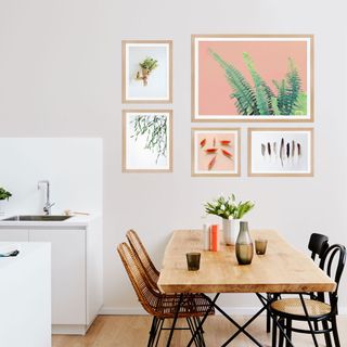 dining room with photoframe on white wall
