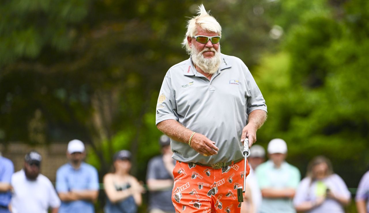 Daly walks with his putter