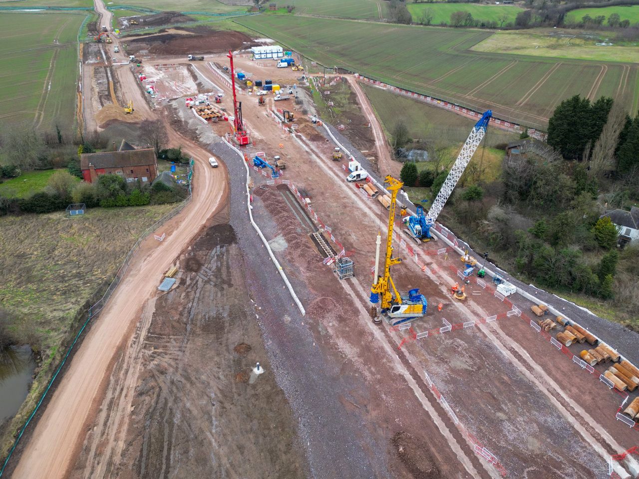 An aerial view of the groundworks construction of the HS2 high speed rail network progresses around the A38 dual-carriageway near Streethay, Lichfield.