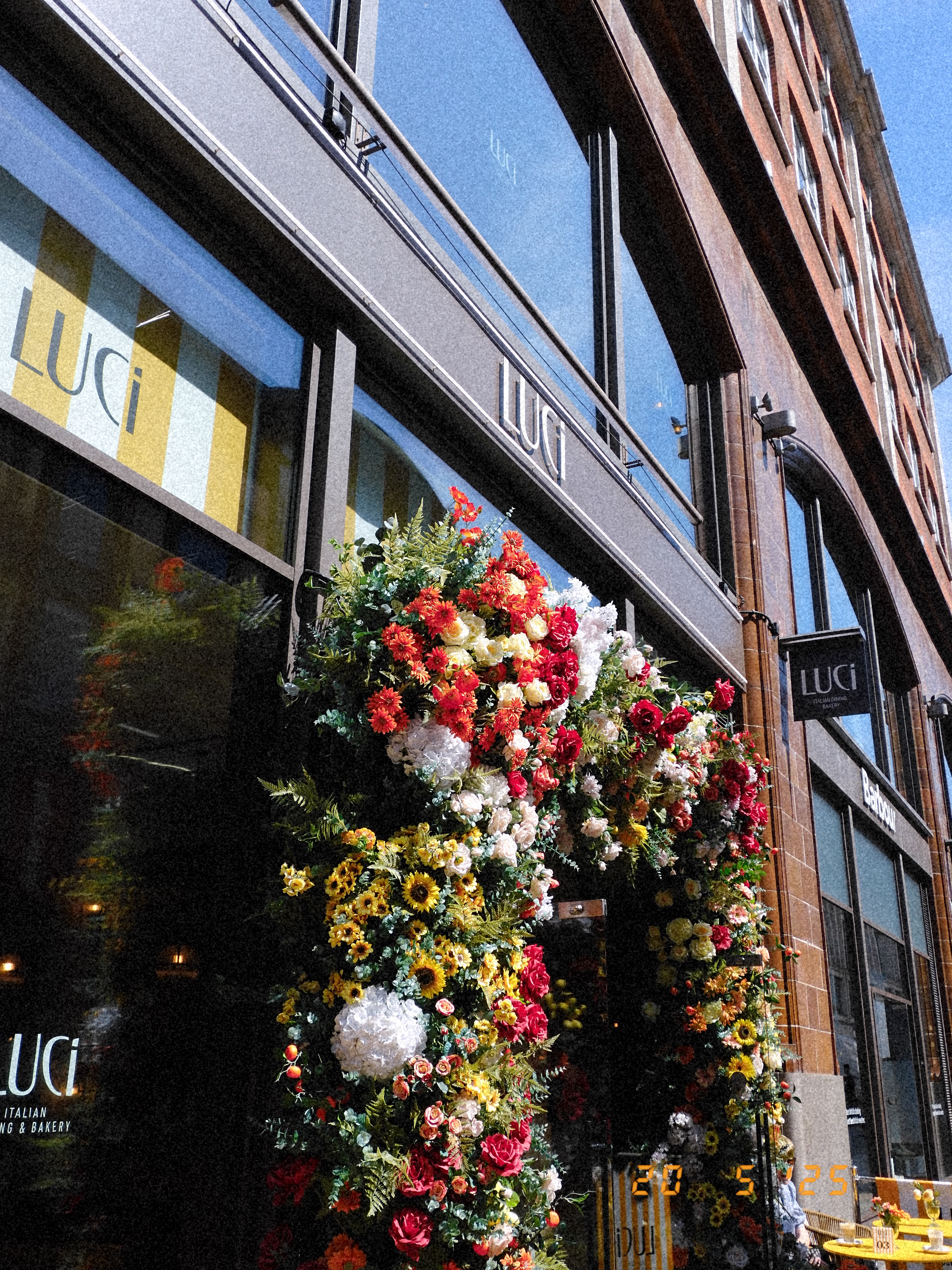 Flower arch around a storefront entrance