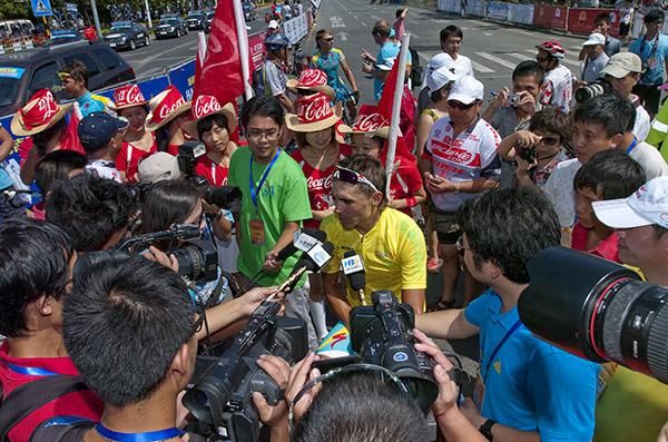 A man in demand: Tour winner Valentin Iglinskiy (Astana) speaks to media after his win in Sanya.