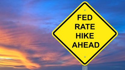 what happens after the next fed rate hike? yellow sign saying fed rate hike ahead