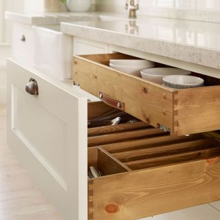 kitchen with sleek silestone worktop and wooden drawer