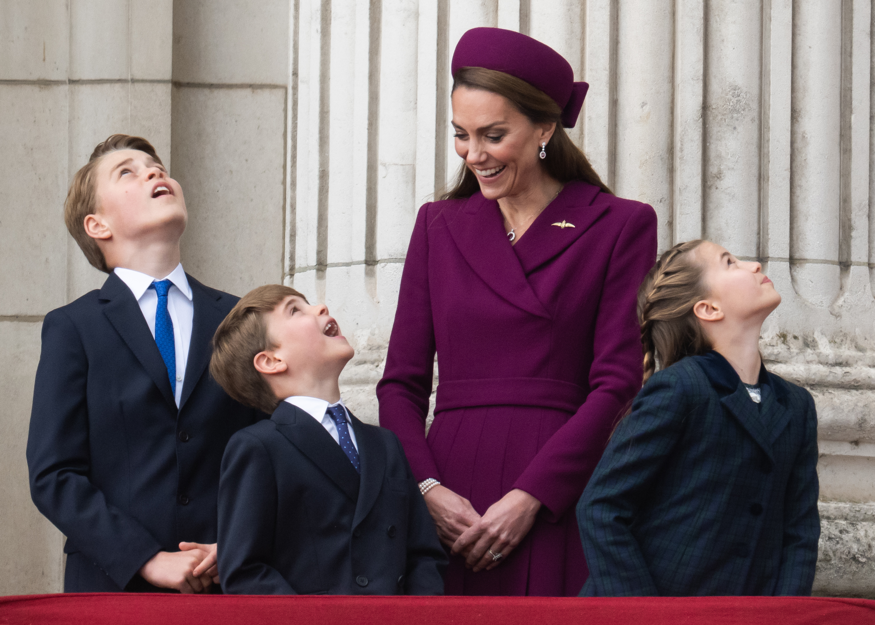 Prince George, Prince Louis, Princess Charlotte and Princess Kate watching a flypast on VE Day 80