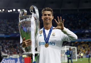 Cristiano Ronaldo celebrates his fifth Champions League win with the trophy after Real Madrid's victory over Liverpool in the 2018 final in Kyiv.