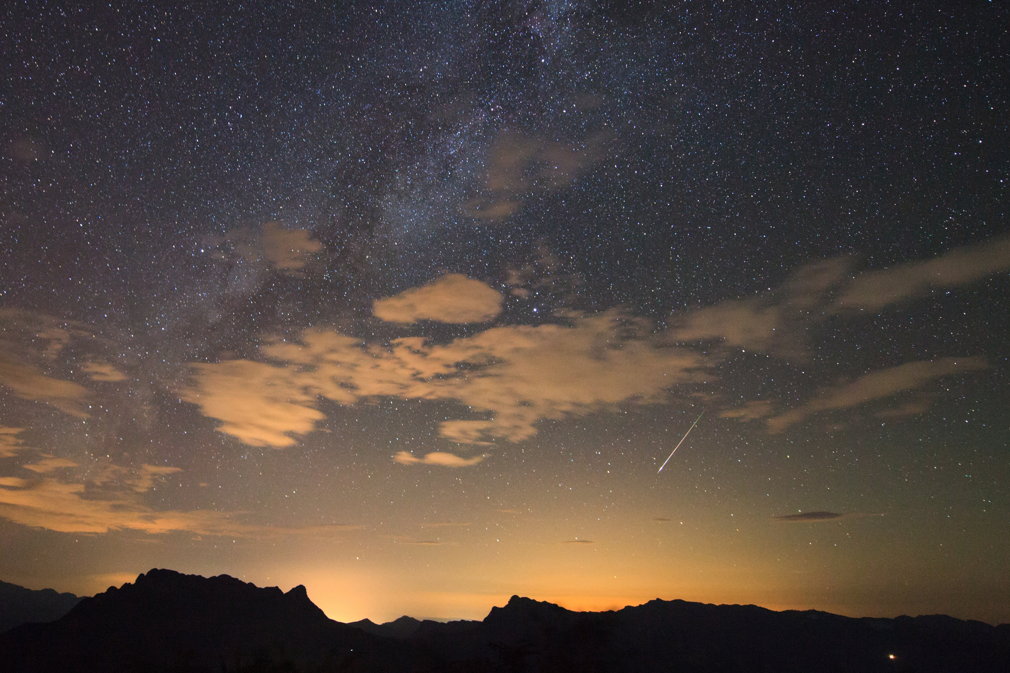 Photographer Jeff Dai captured this view of a Perseid meteor shower fireball streaks above the city lights of Nanchuan in western China on Aug. 11, 2013. Dai took the photo from Mount Jinfo, Chongqing, China.