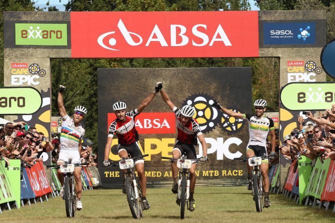 All African Jersey holders Gert Heyns (centre left) and Matthys Beukes (centre right) of SCOTT Factory Racing celebrate winning the final stage as Nino Schurter (far left) and Philip Buys (far right) of SCOTT-Odlo MTB Racing celebrate finishing second during the final stage (stage 7)