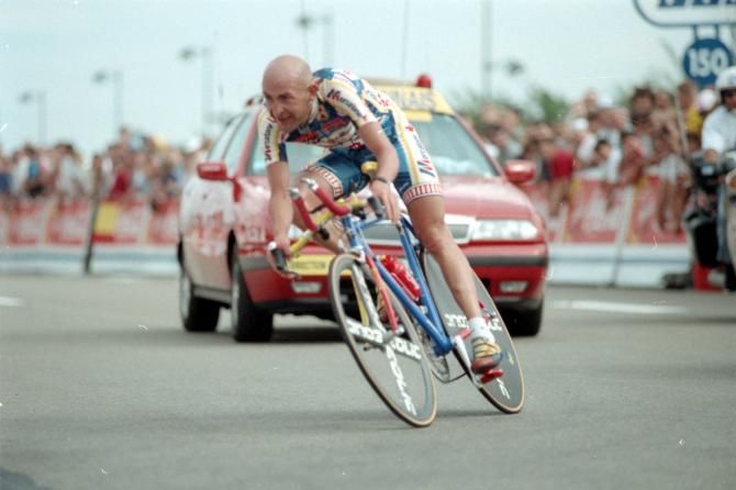 Marco Pantani streaks around the 1997 Tour de France time trial in Disneyland with a rear disc wheel, four-spoke carbon front wheel, and aero bars.