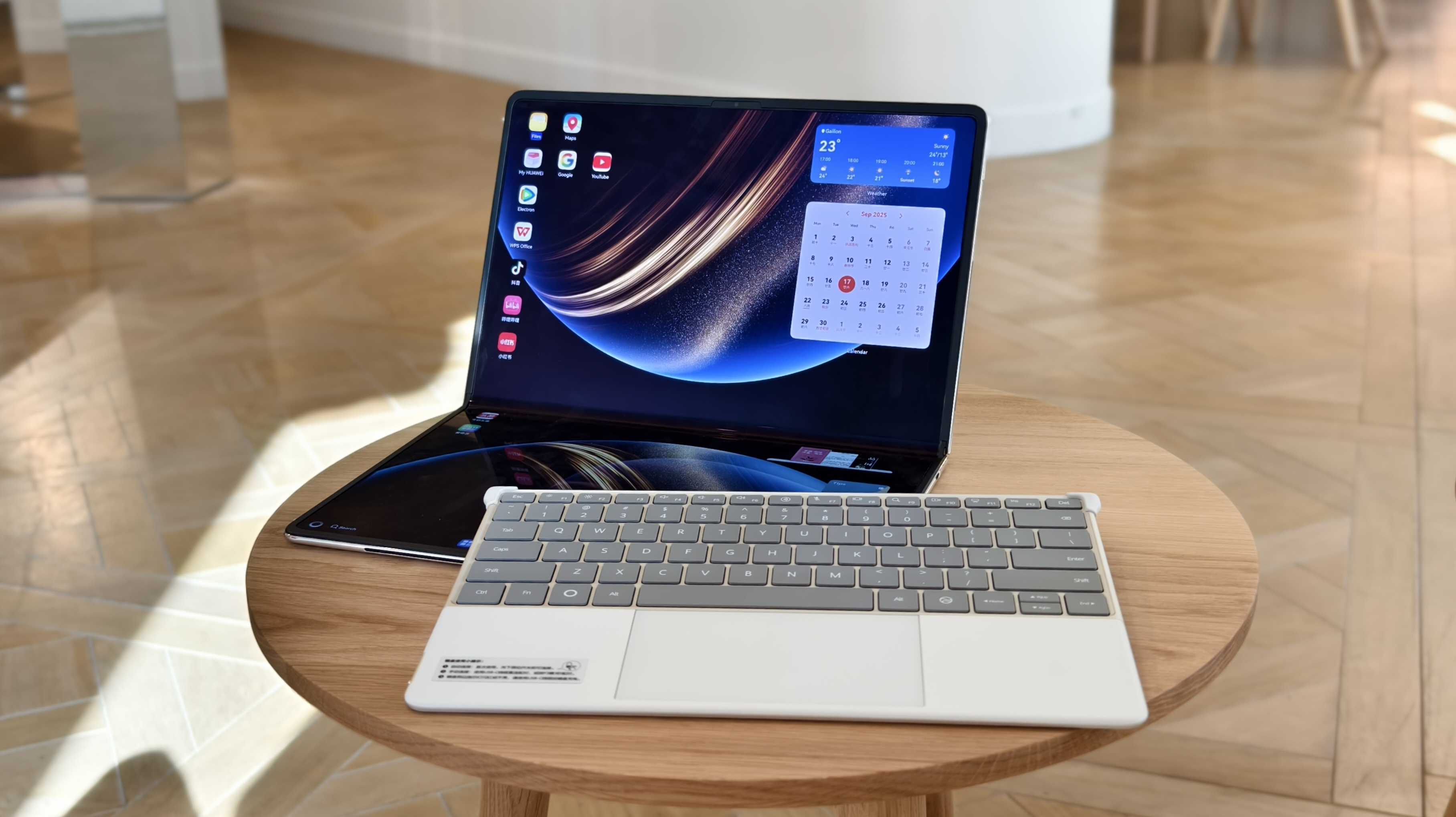 Huawei MateBook Fold screen and keyboard kept separately.