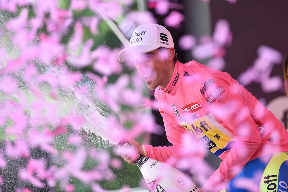 Alberto Contador sprays champagne from the stage 18 podium.