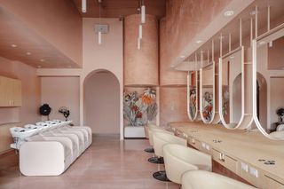 Wash basins, chairs and mirrors at the Pressed Roots hair salon in Texas