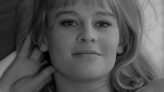 Julie Christie smiles at the camera in Darling