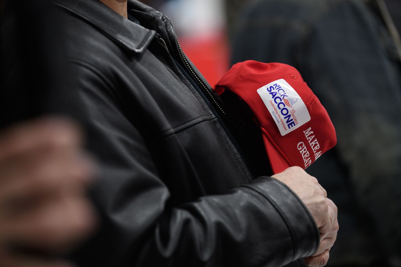 A Trump supporter with a Saccone sticker