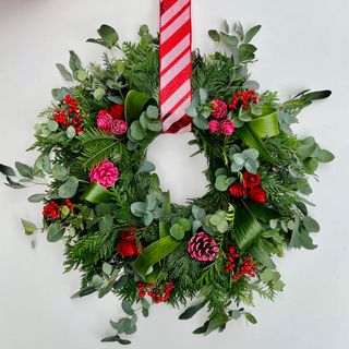Picture of festive wreath with pink ribbon