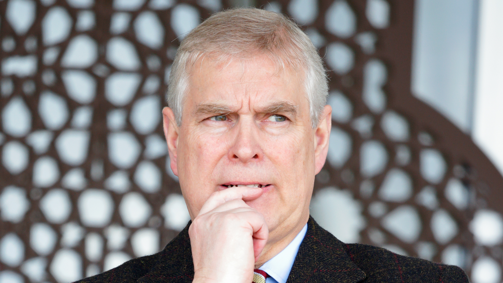 Prince Andrew putting his finger to his mouth