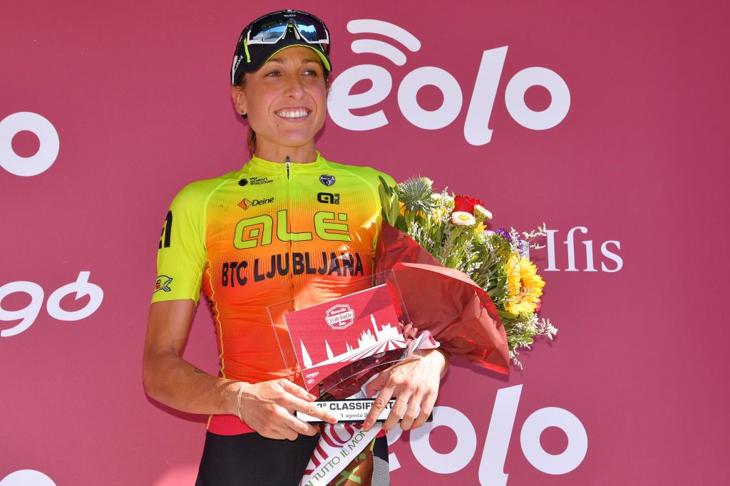 SIENA ITALY AUGUST 01 Podium Margarita Victoria Garcia Caellas of Spain and Team Ale BTC Ljubljana Celebration Trophy Flowers during the Eroica 6th Strade Bianche 2020 Women Elite a 136km race from Siena to Siena Piazza del Campo StradeBianche on August 01 2020 in Siena Italy Photo by Luc ClaessenGetty Images