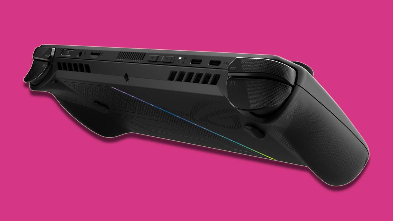 black PC gaming handheld against pink background