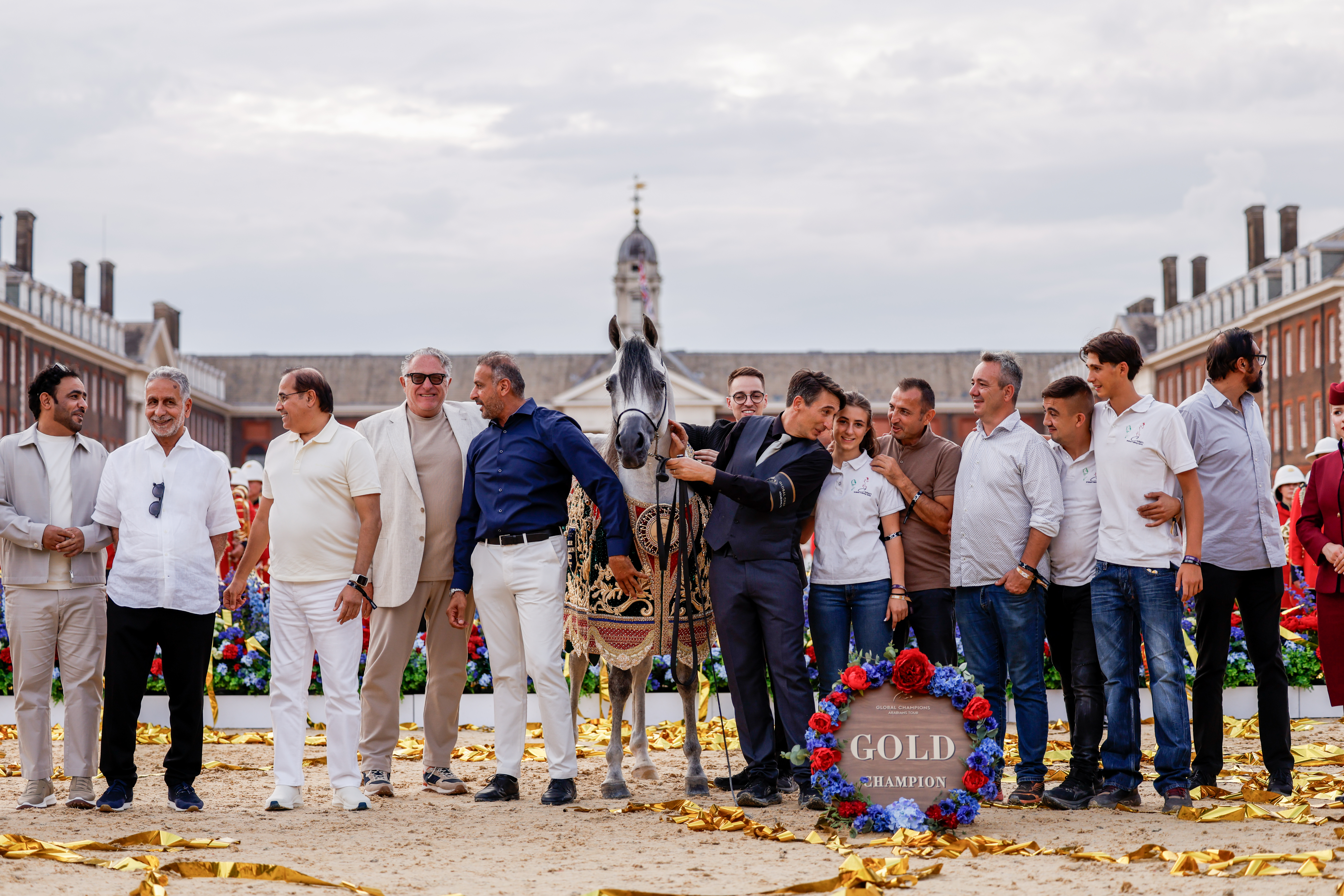 Global Champions Arabians Tour senior stallion champion D Shahhar wears a gold embroidered rug and stands among the broader Dubai Arabian Horse Stud team after he won at the 2026 GCAT 